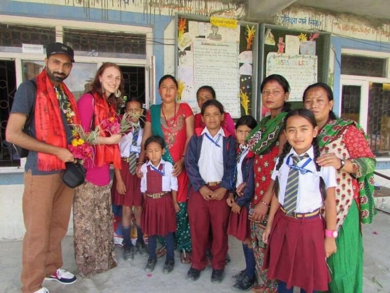 Care4Nepal supporters with schoolchildren and mothers at a school in Nepal